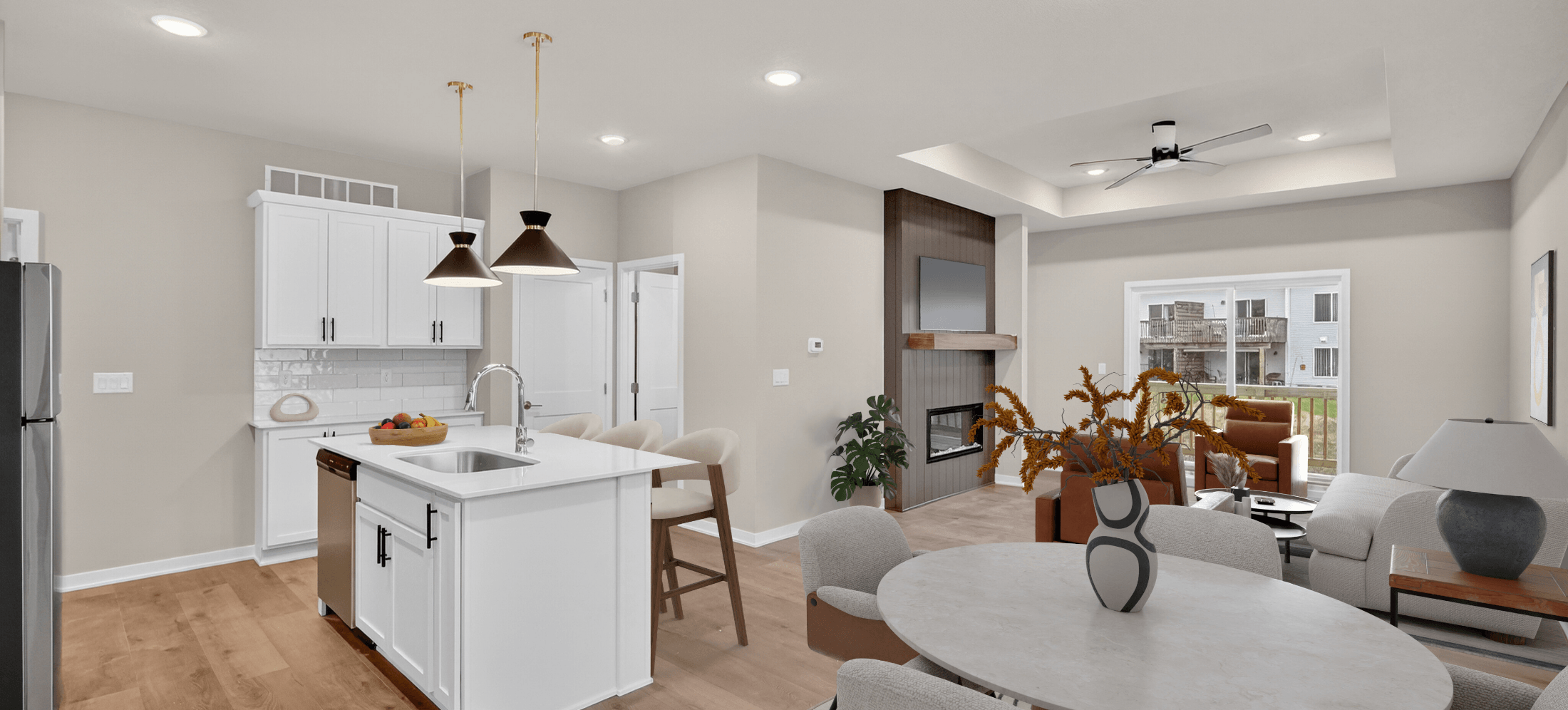open-concept apartment with kitchen, dining table, and living area