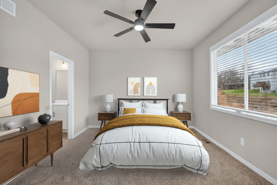 Modern bedroom with neutral decor, ceiling fan, and large window